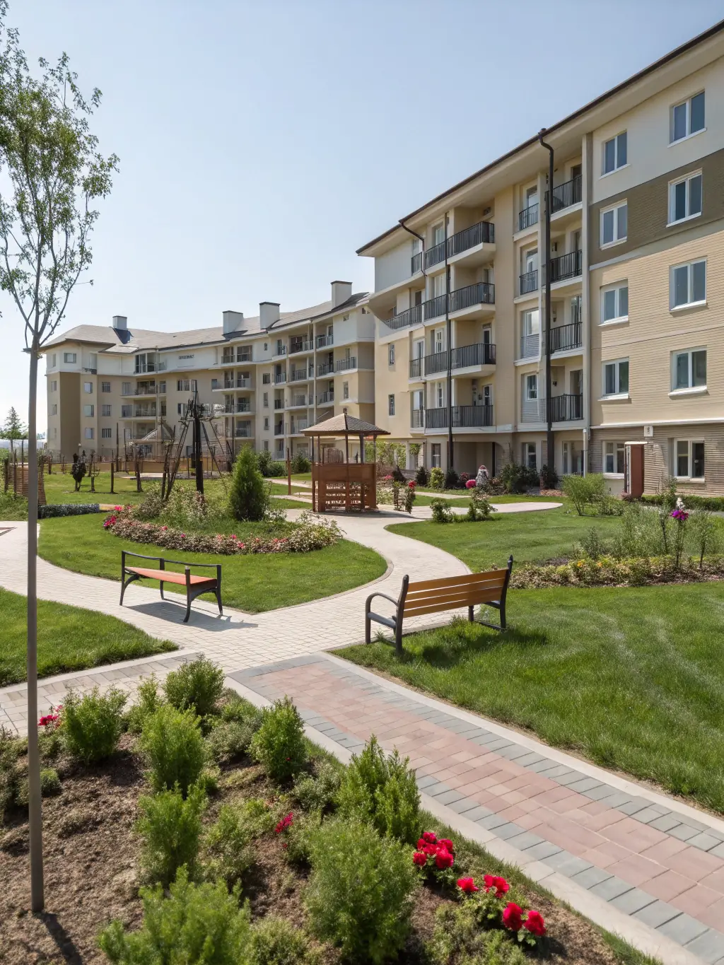 A well-maintained apartment complex with lush landscaping, showcasing Prestige Group's property management services.